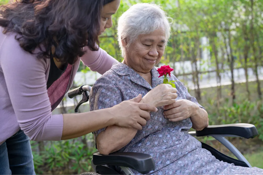 Disabled woman with rose flower in hand